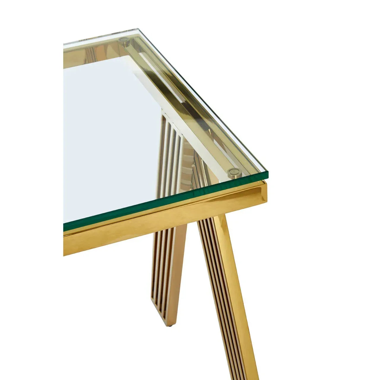 Glass top dining table with gold metal legs, corner view showing frame details