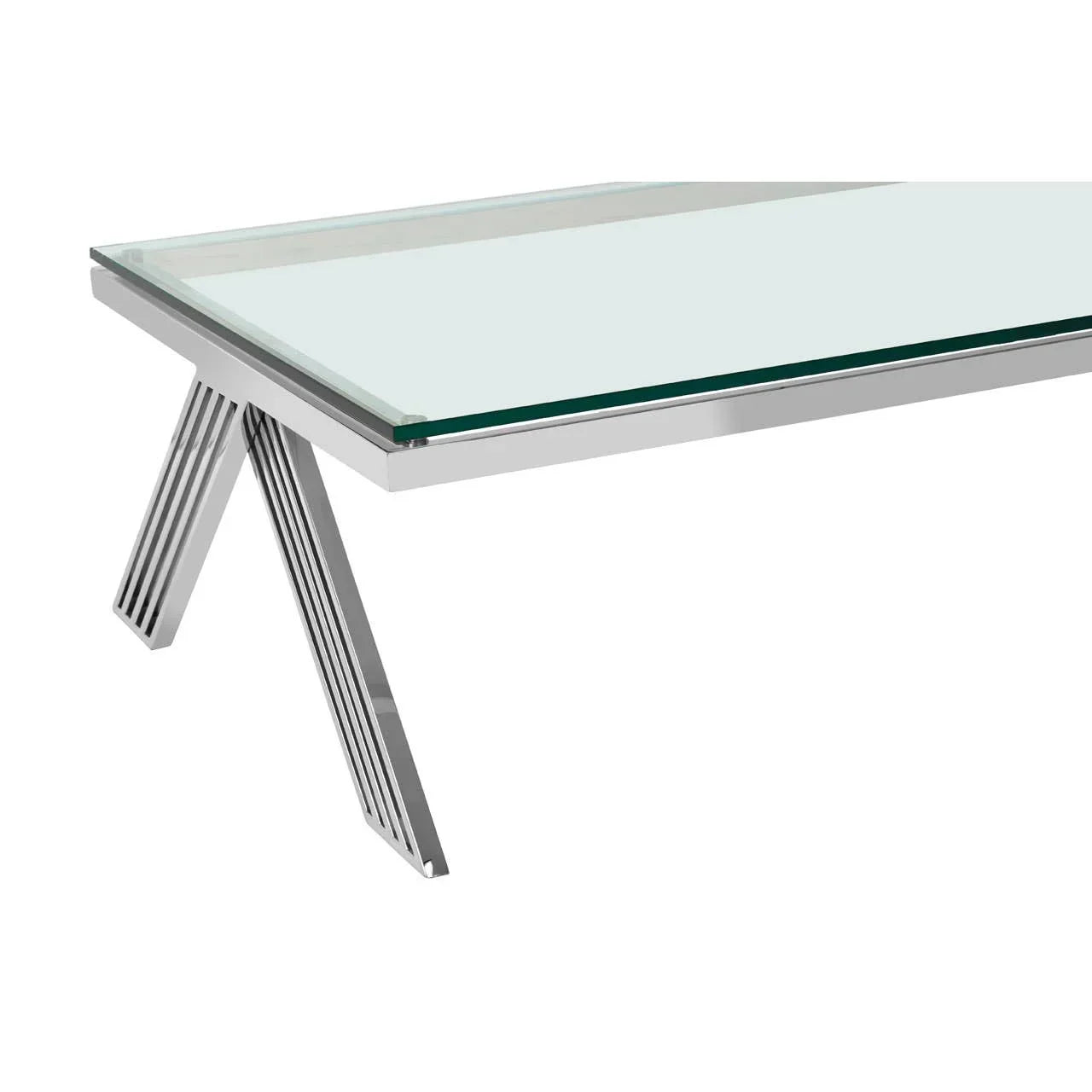 Modern glass dining table with chrome metal legs, close-up of tabletop and base detail