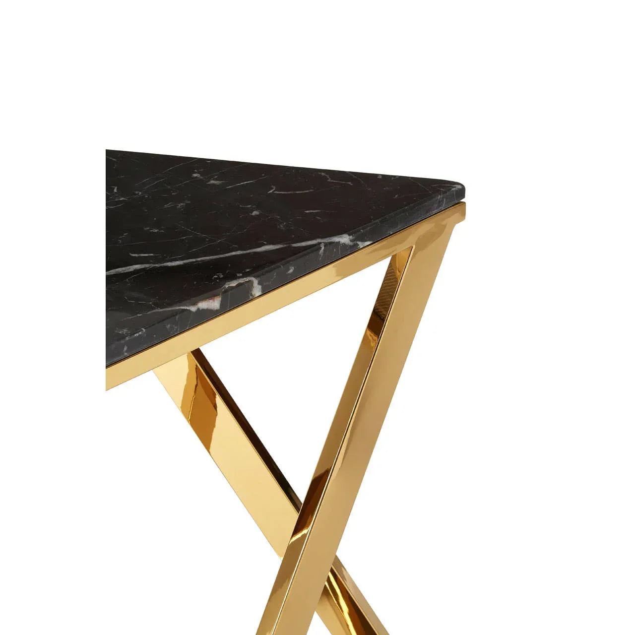 Black marble table top with gold metal legs, close view of corner and frame detail