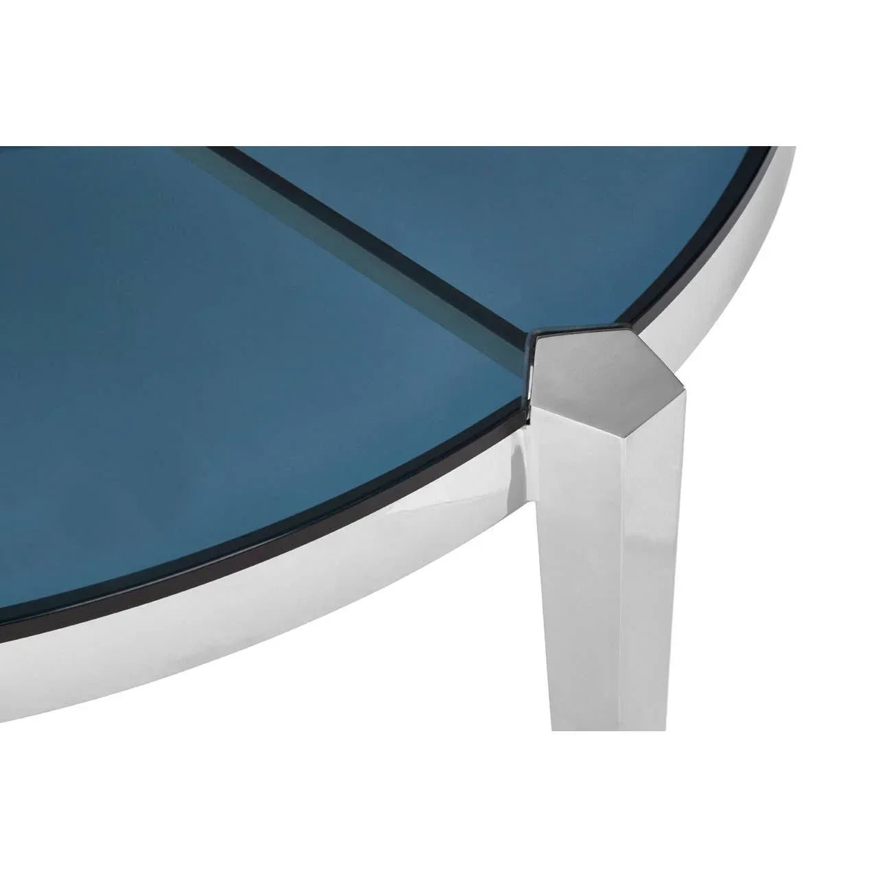Closeup of round glass coffee table with chrome metal frame and blue-tinted tabletop