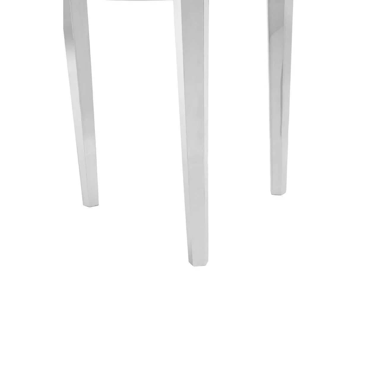 Closeup of chrome dining table legs with reflective finish