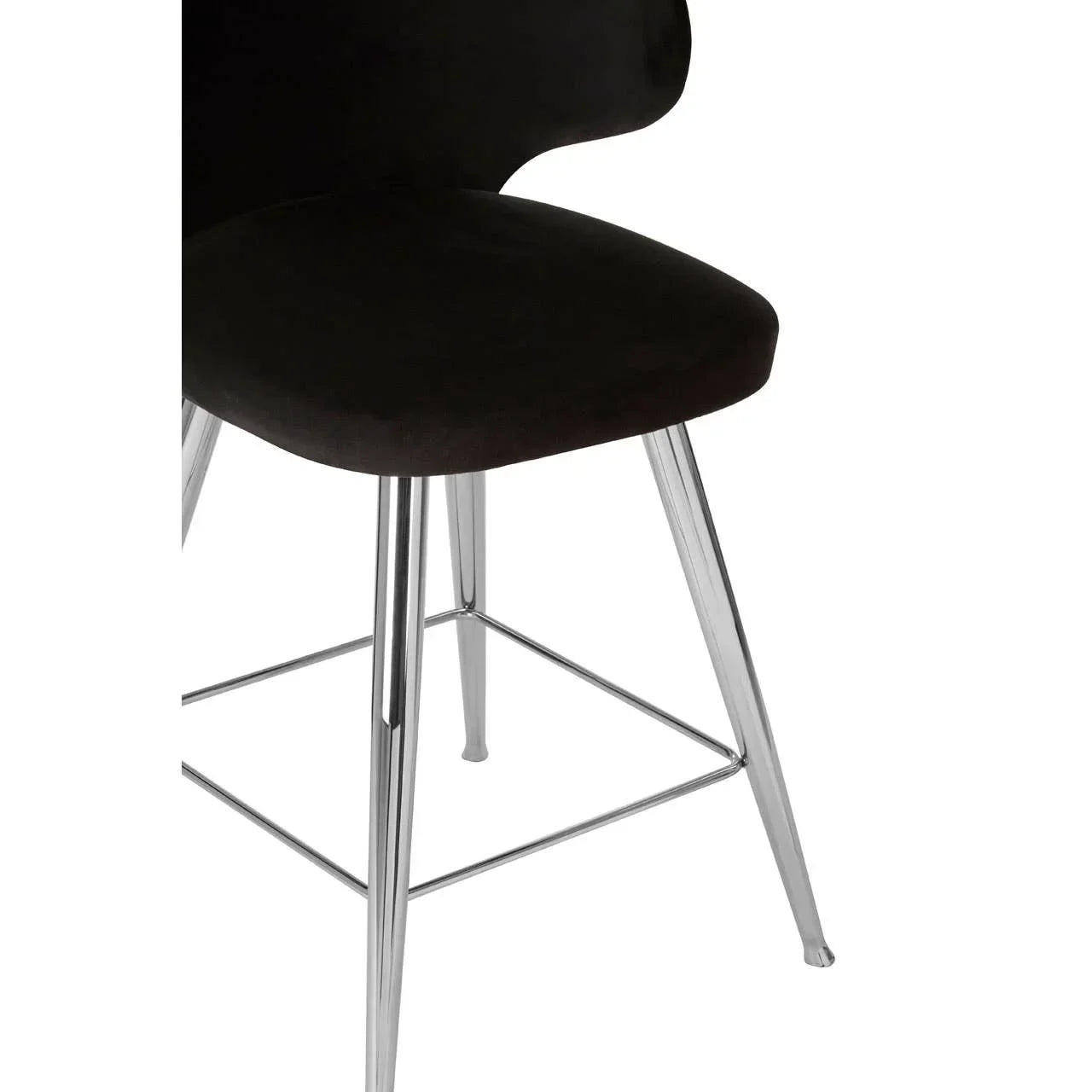Black velvet dining chair with chrome legs, close view of seat and base