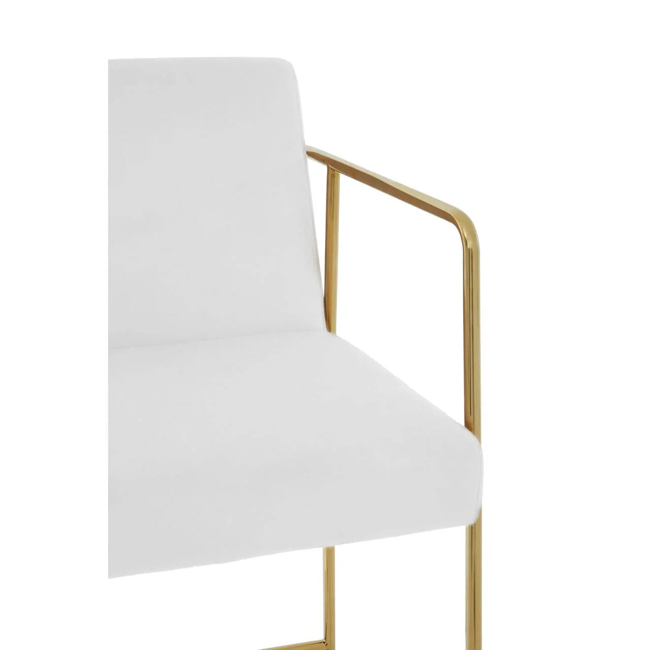 Close-up of white upholstered chair with gold metal armrest and modern design
