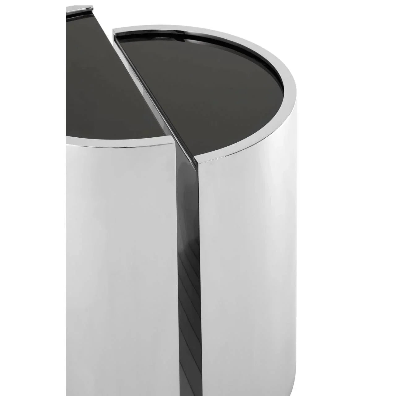 Round chrome side table with black glass top, close-up of modern geometric design