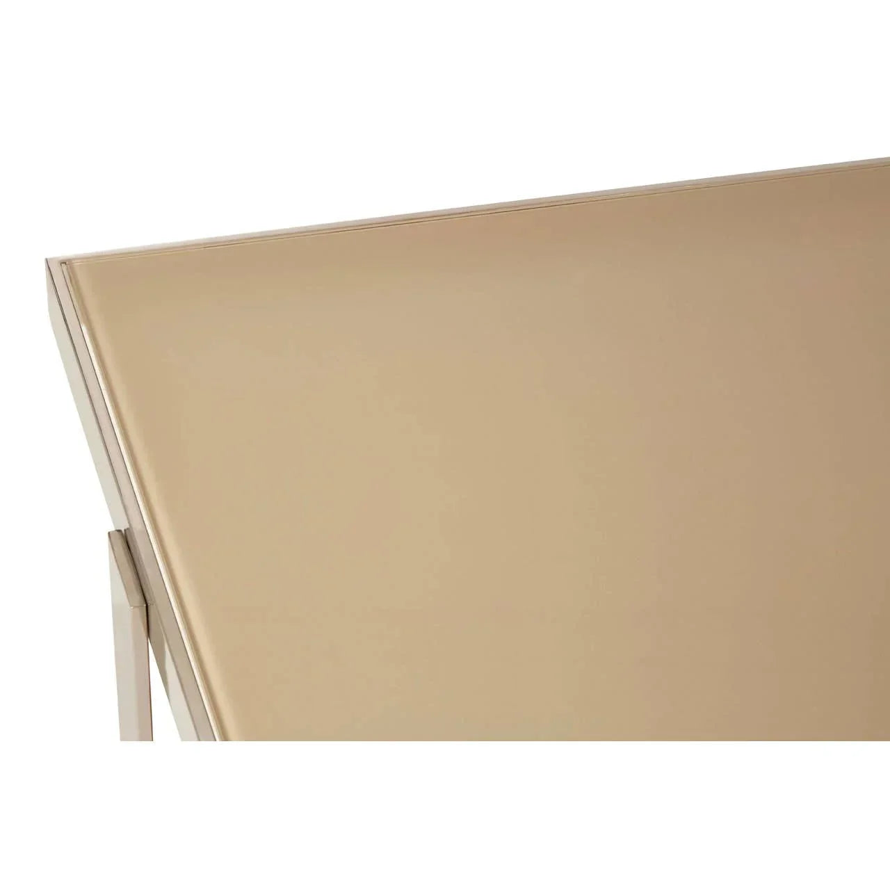 Closeup of rectangular glass table top with gold finish and metallic edge