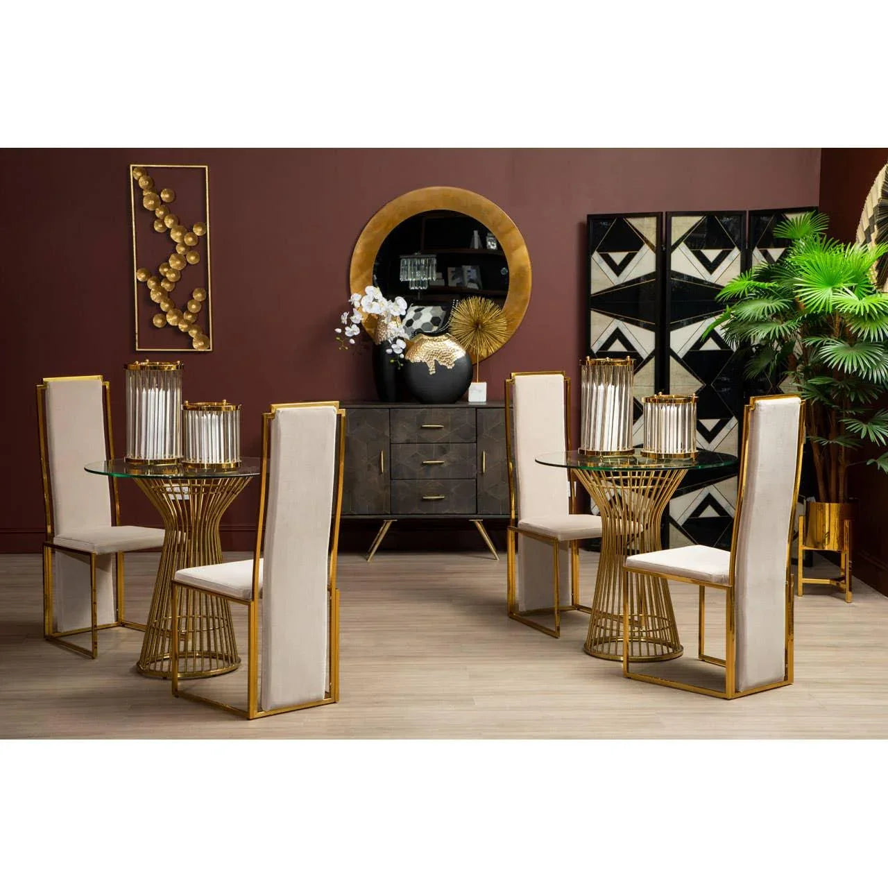 Modern dining set with gold metal frame chairs and round glass tables in contemporary room
