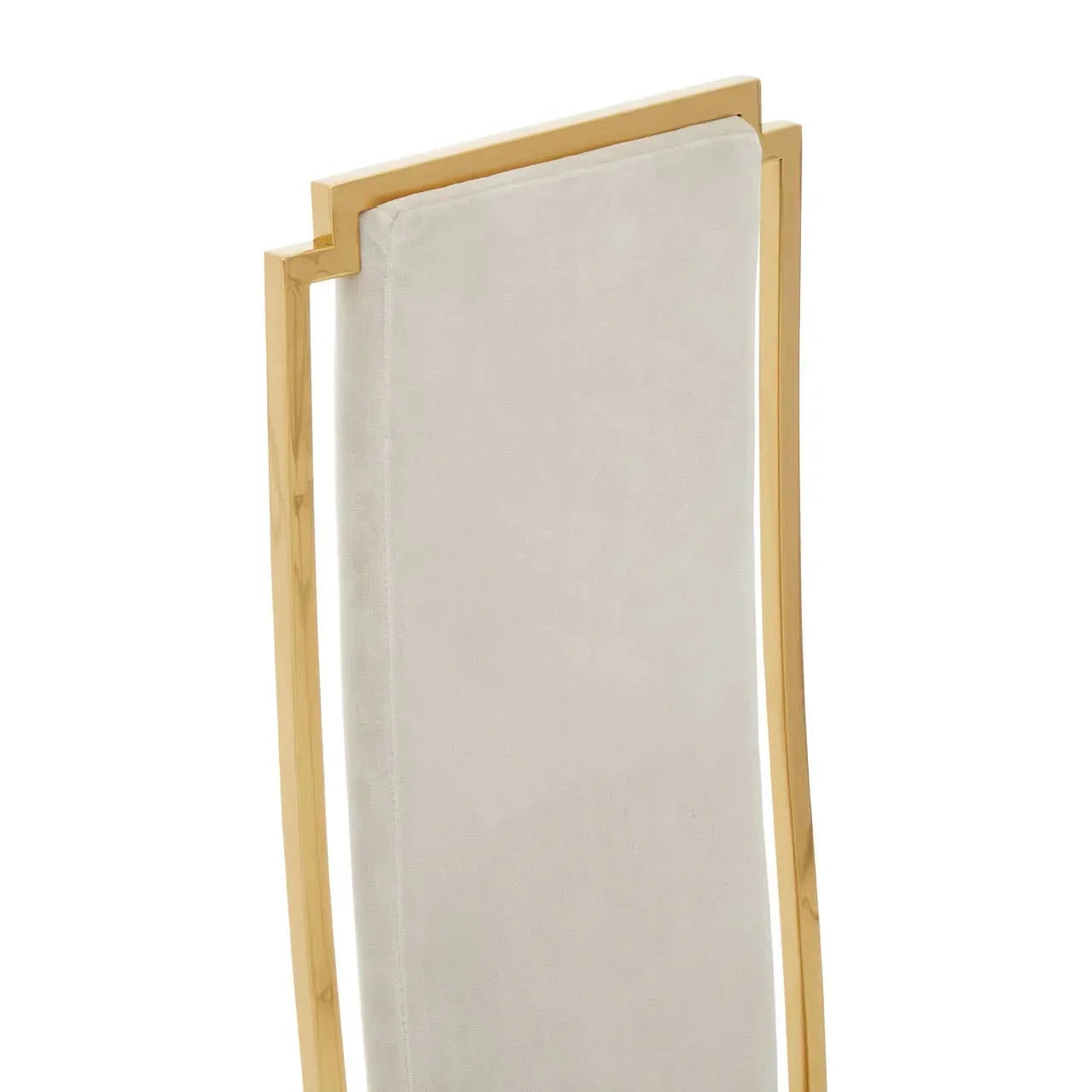 Velvet dining chair backrest with gold metal frame, close-up detail