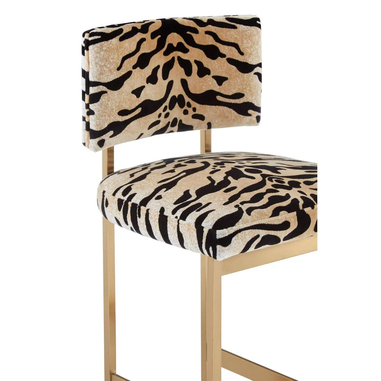Bar stool with gold frame and animal print fabric upholstery on seat and backrest