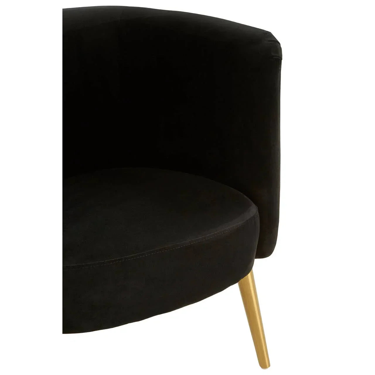 Black velvet armchair with curved back and gold metal leg, close-up view