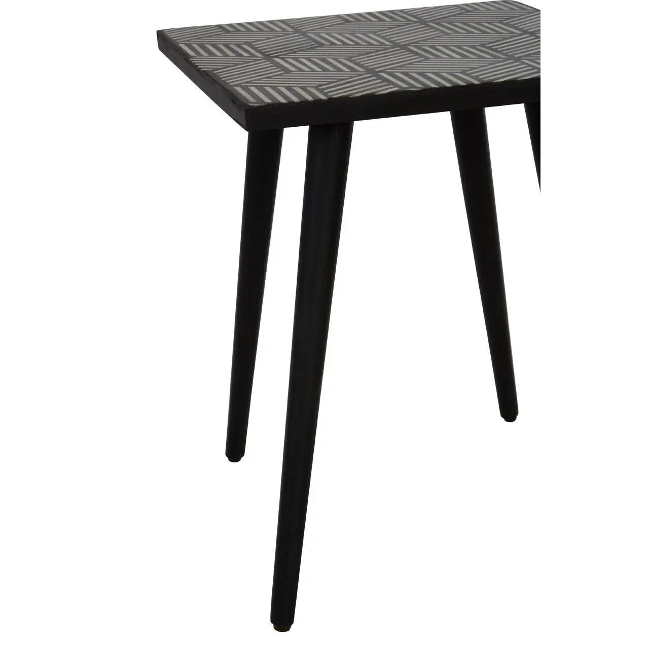 Black wooden table with geometric patterned top and four angled legs