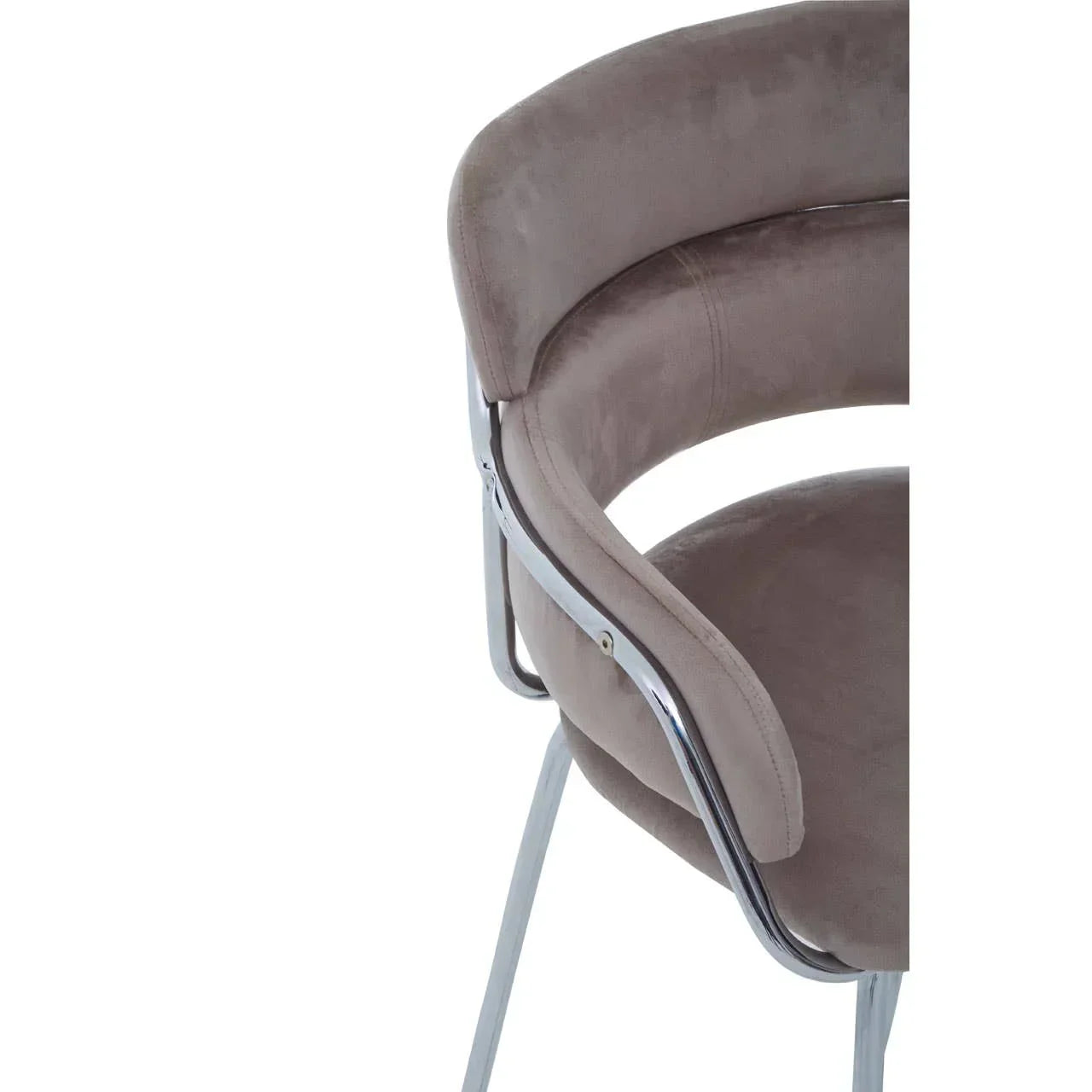 Close up of taupe velvet dining chair with chrome legs and curved backrest