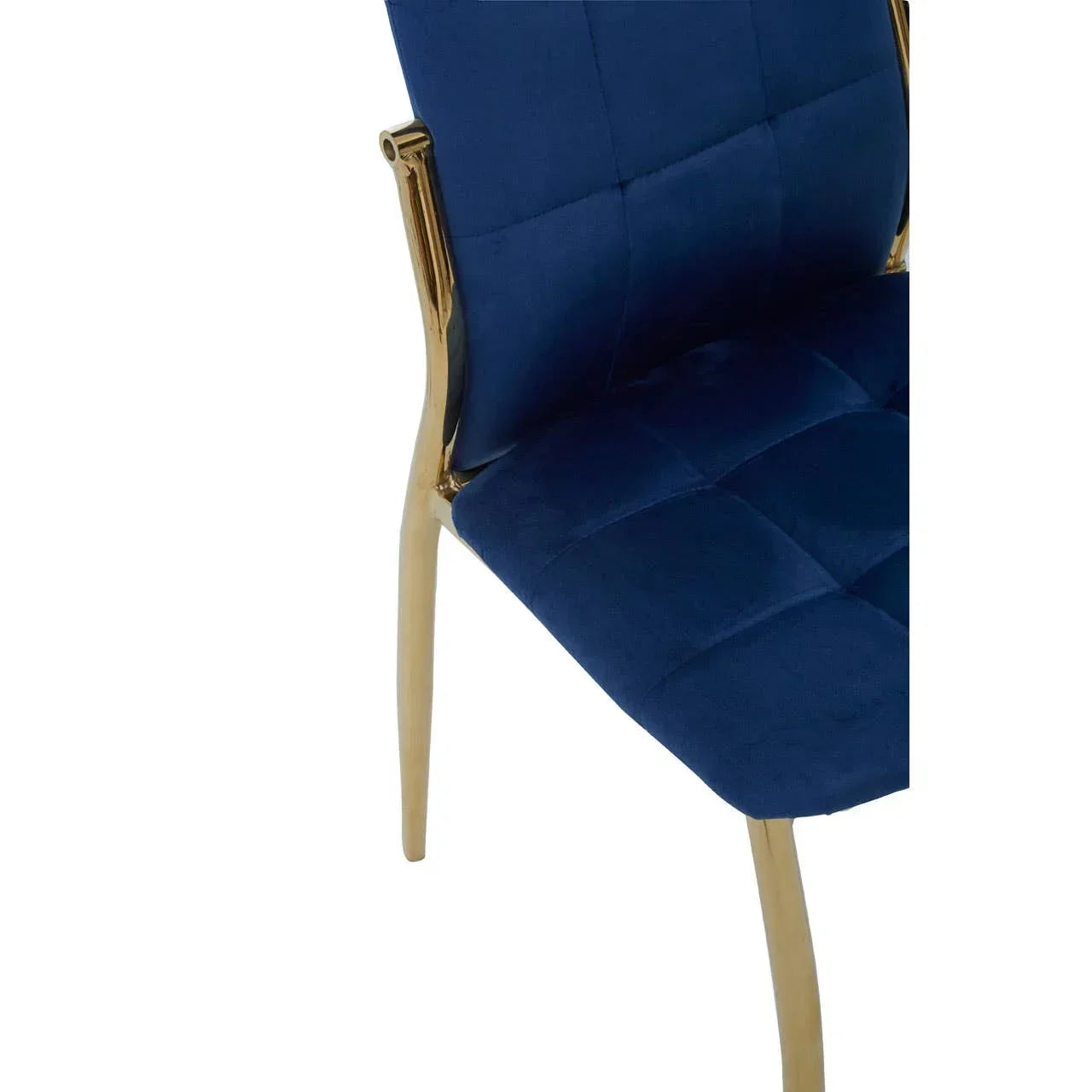 Blue velvet dining chair with gold metal legs and quilted seat closeup