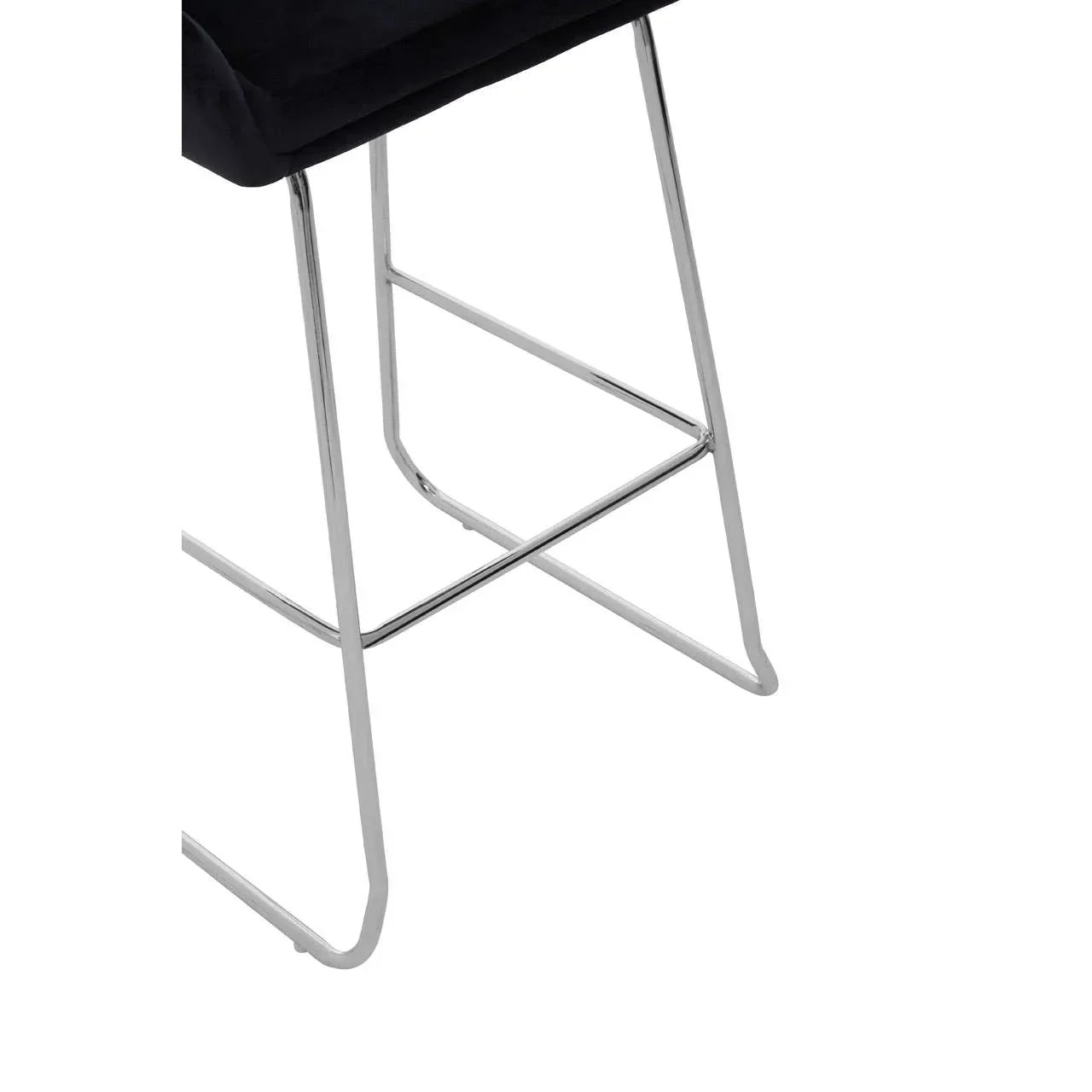 Chrome bar stool legs with black cushioned seat, close-up on frame and support bar