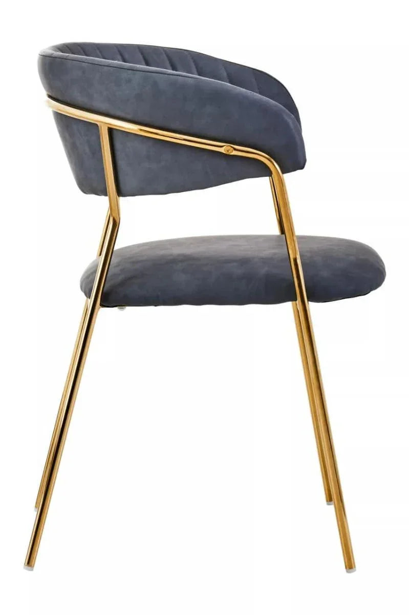 Velvet dining chair with gold metal frame and curved backrest, side profile view