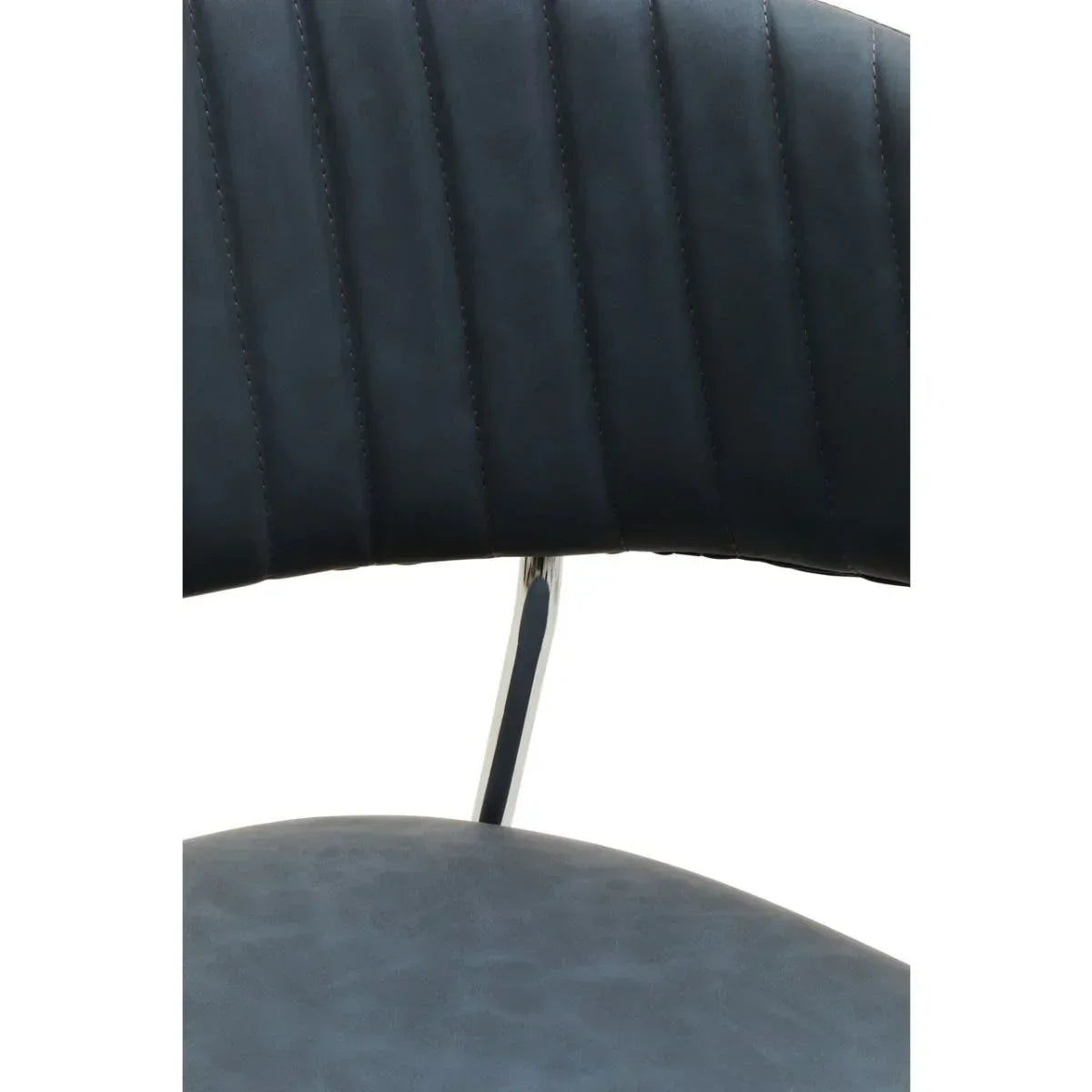 Close-up of black dining chair with stitched faux leather backrest and chrome support