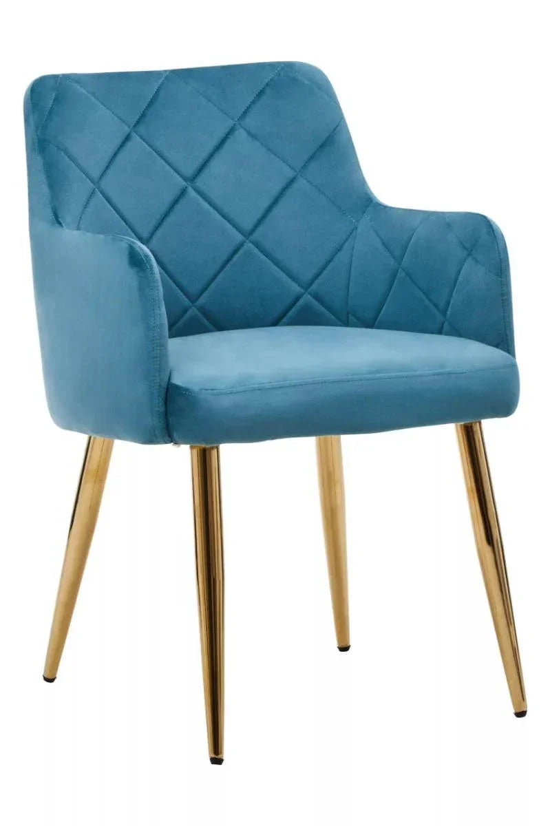 Blue velvet dining chair with gold metal legs and quilted backrest, front angle view
