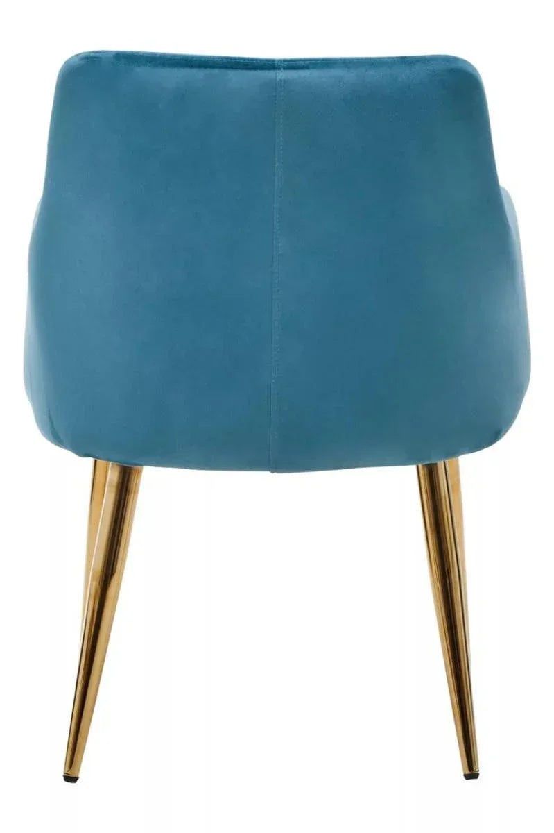 Blue velvet accent chair with gold metal legs, rear view