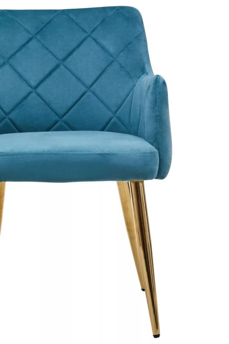 Blue velvet dining chair with quilted backrest and gold metal legs