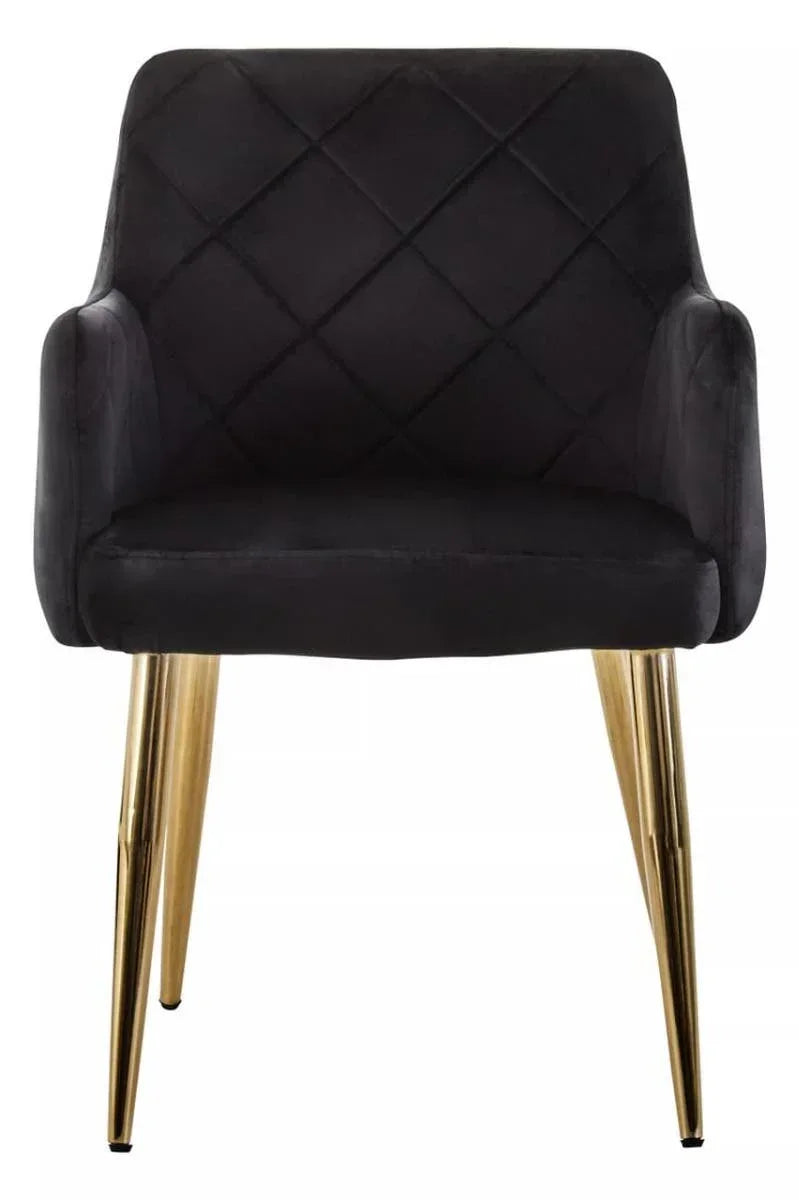 Black velvet accent chair with quilted backrest and gold metal legs, front view