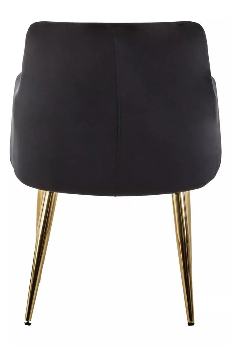 Black dining chair with gold metal legs, rear view