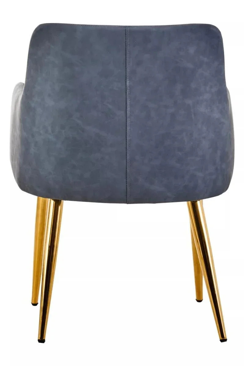Blue upholstered dining chair with gold metal legs, rear view