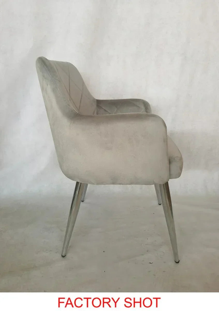Grey velvet dining chair with metal legs, side view showing quilted backrest detail
