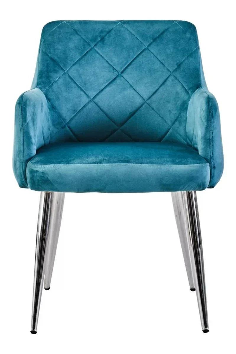 Blue velvet dining chair with quilted backrest and chrome legs, front view
