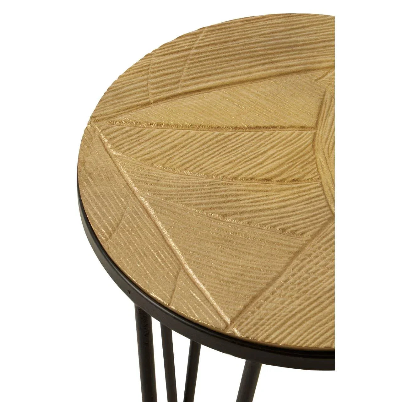 Round wooden side table with geometric textured top and black metal legs, close-up view
