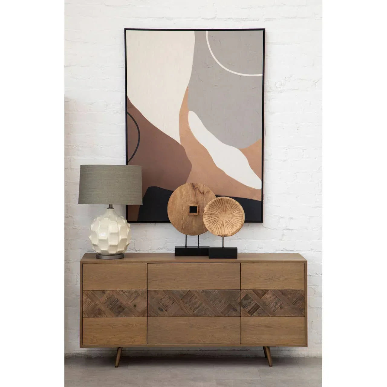 Oak sideboard with geometric panel, table lamp, wooden decor, abstract wall art