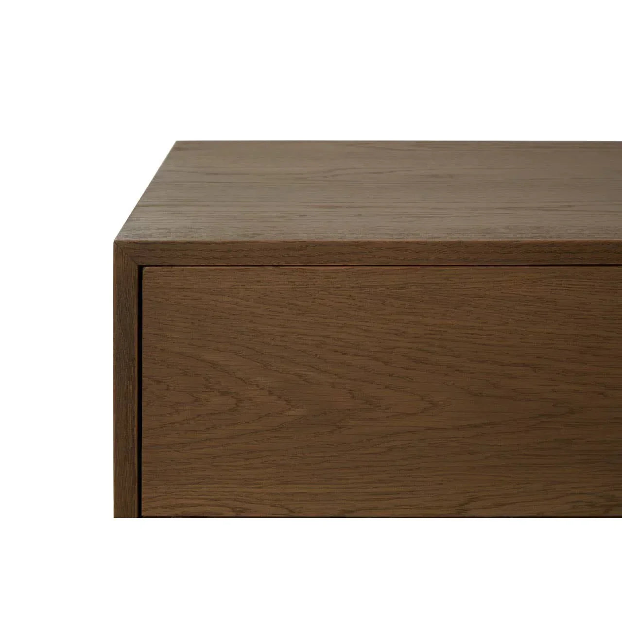 Closeup of oak wood drawer front on modern sideboard furniture