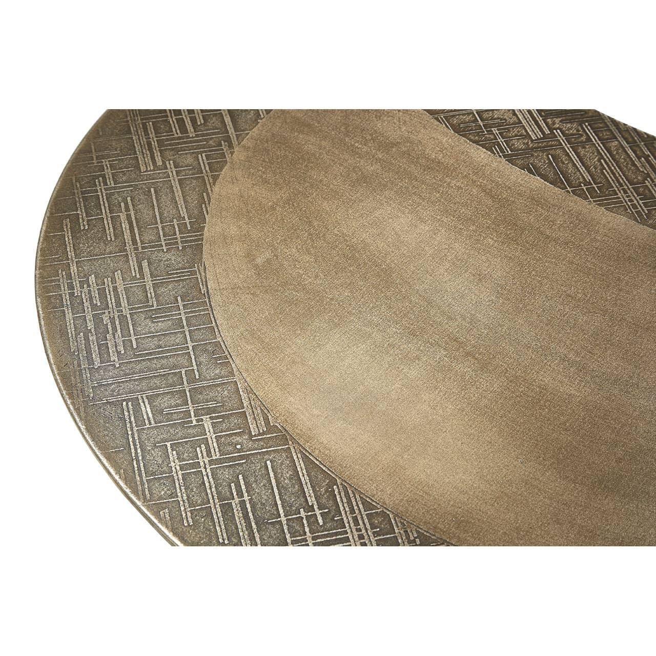 Round bronze dining table with textured geometric edge detail and smooth center surface