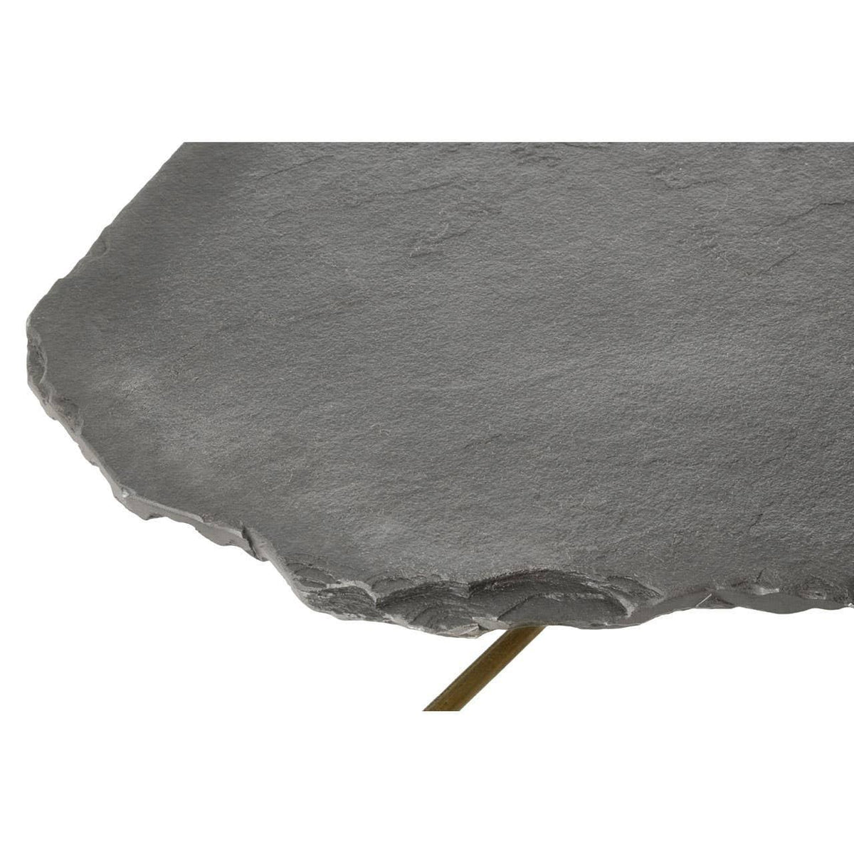 Closeup of grey stone coffee table top with natural rough edge and metal leg