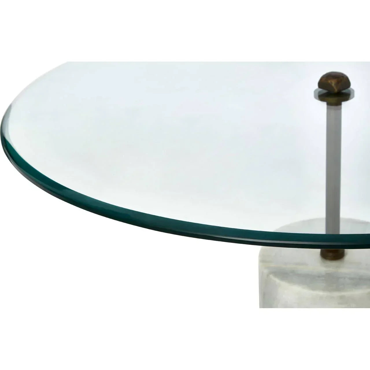 Round glass coffee table with metal support and stone base, close-up view