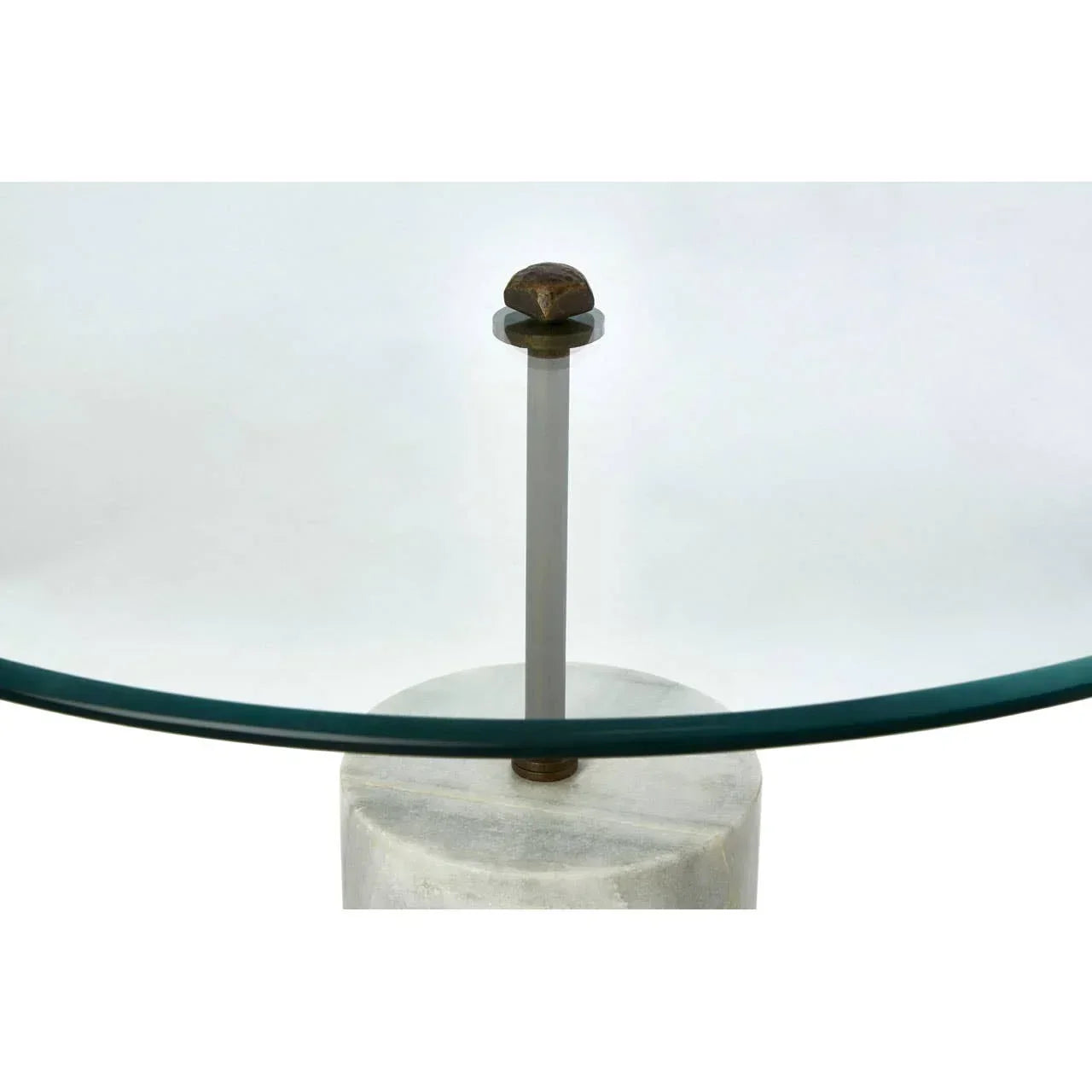 Glass coffee table top with metal support and concrete base detail