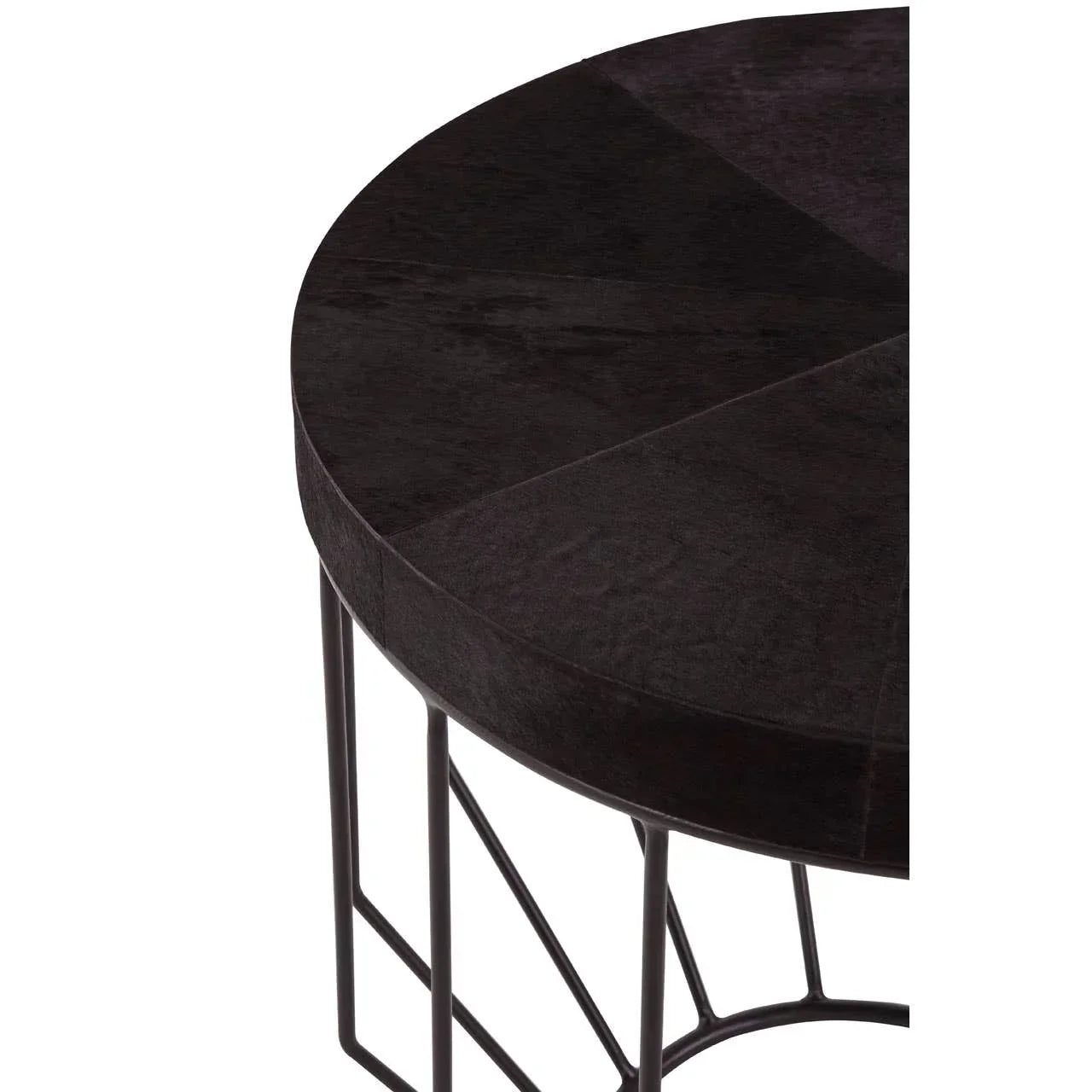 Round black wood side table with geometric metal base, close-up view of top and legs