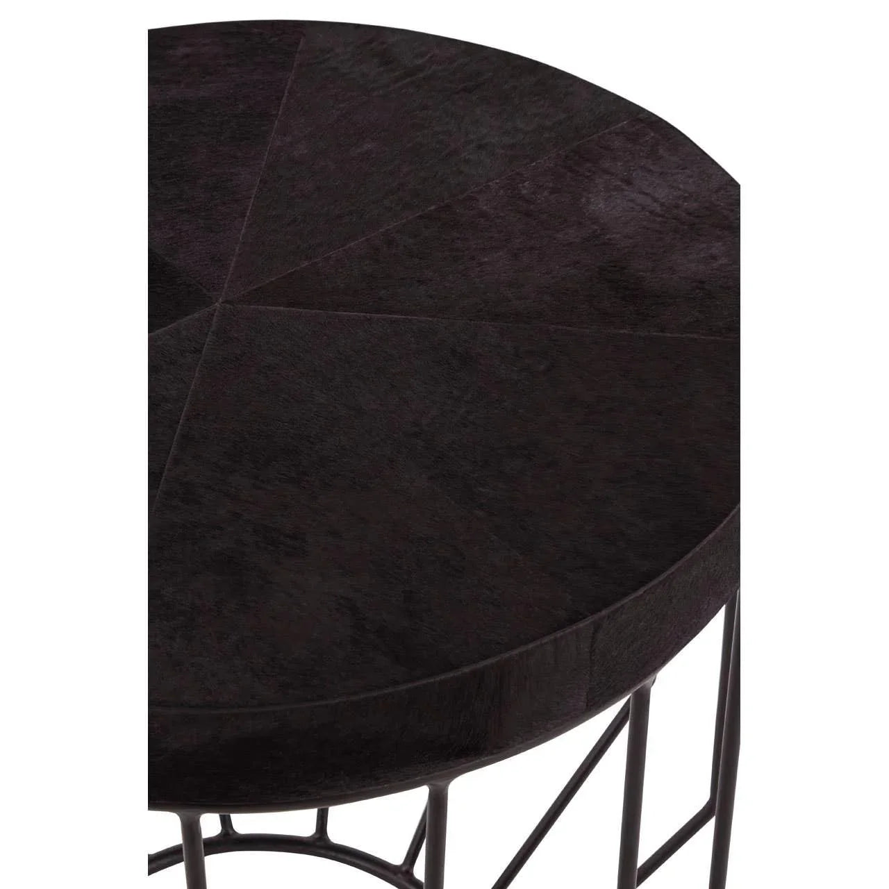 Round dark wood coffee table with geometric top and metal legs, close-up view
