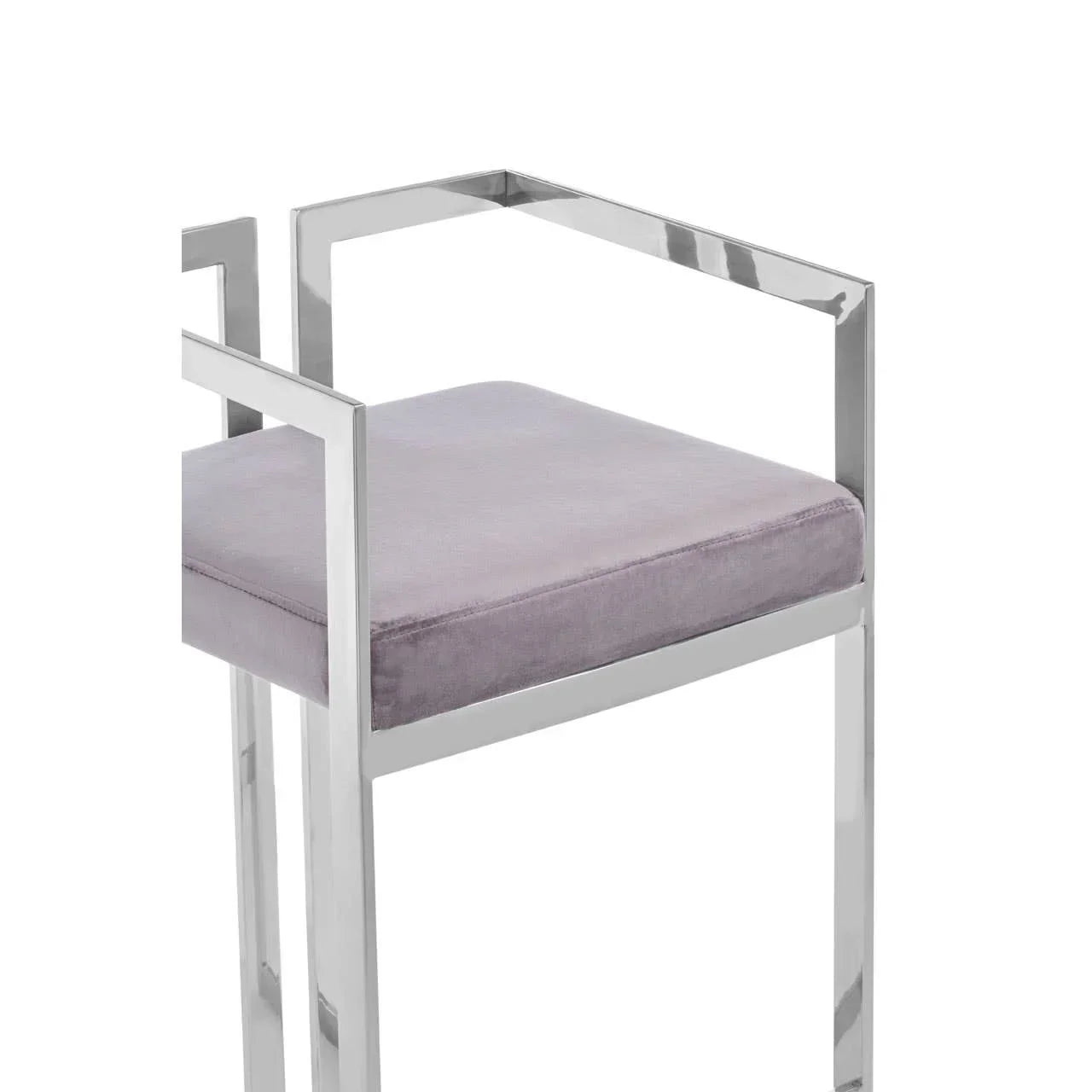Modern bar stool with chrome frame and grey velvet seat, angled armrest detail visible