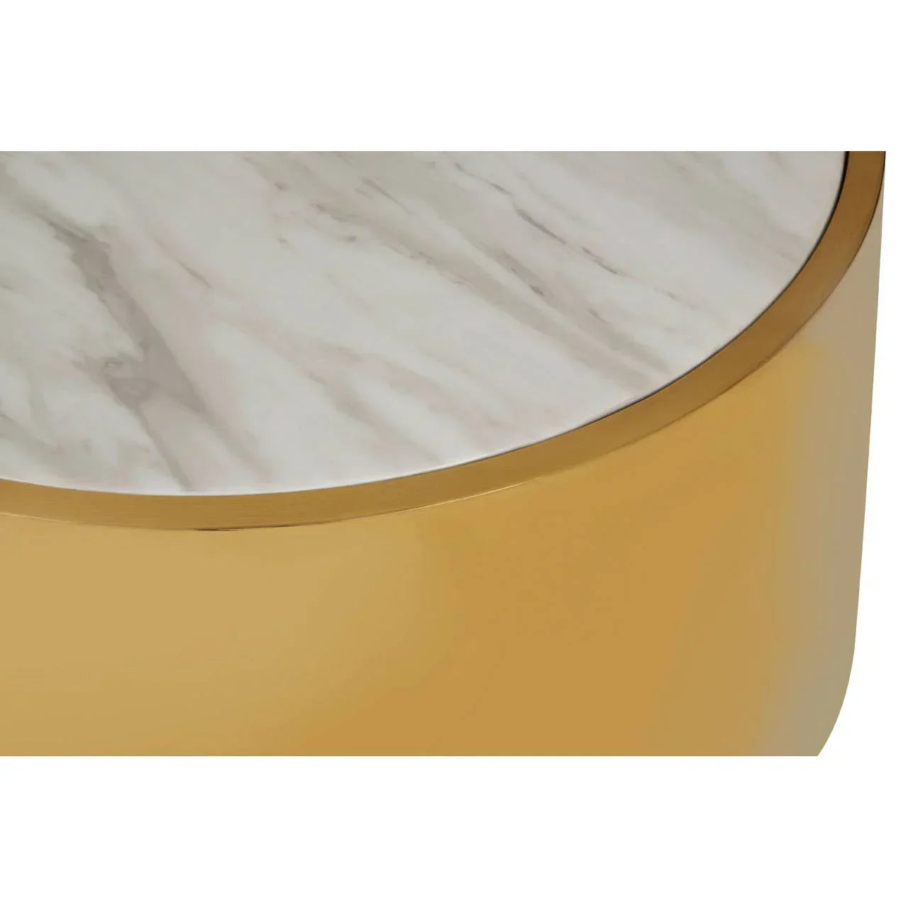 Round coffee table with white marble top and gold metallic base, close-up angle