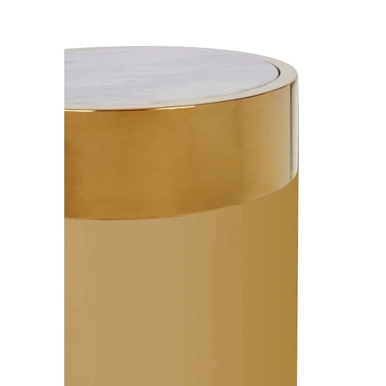 Round side table with gold metal base and white marble top, close-up side view