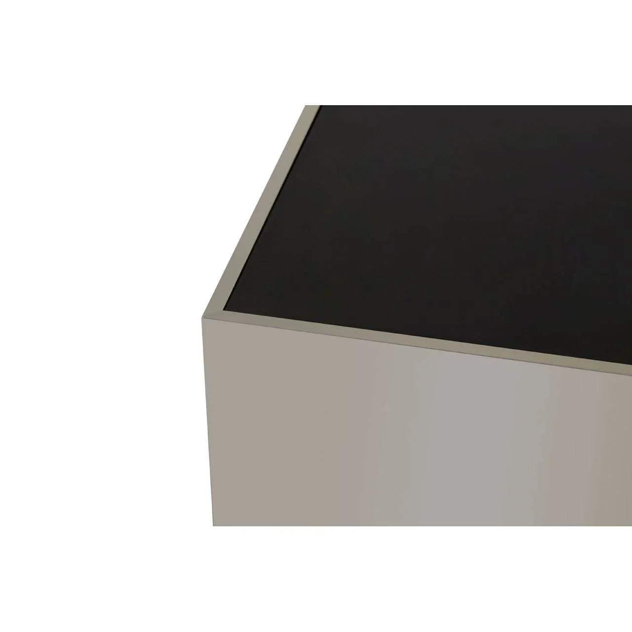 Corner detail of modern coffee table with black glass top and metal frame