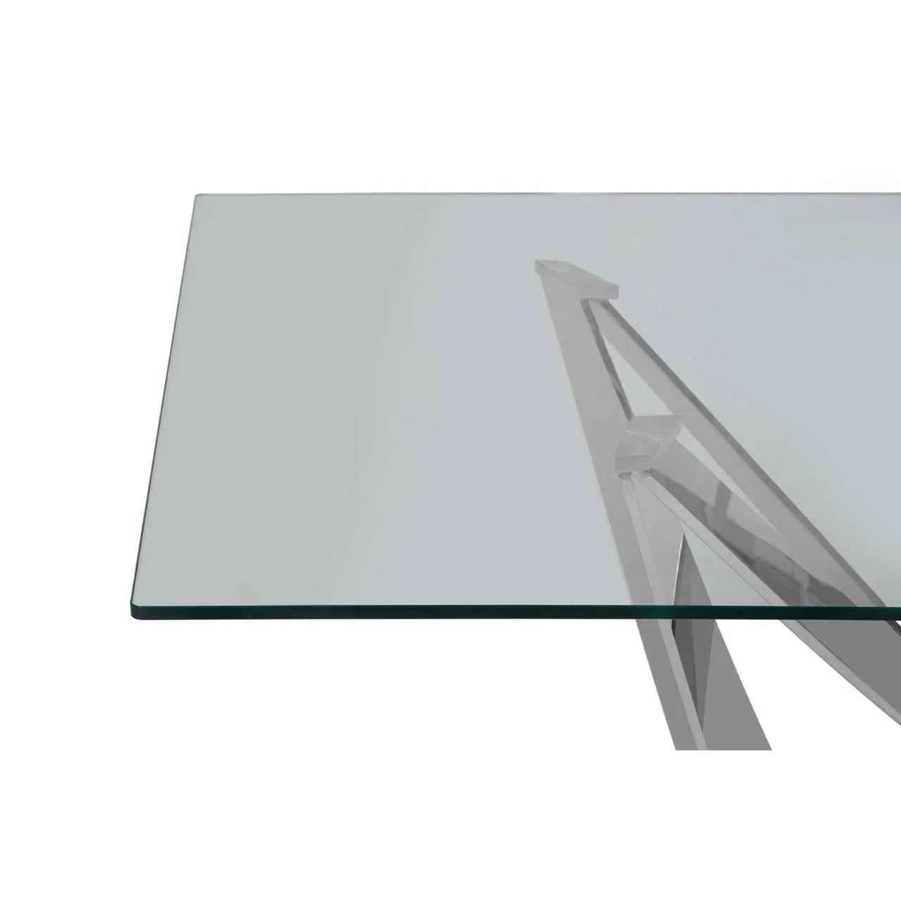 Rectangular glass dining table top with modern metal angled legs, close-up view