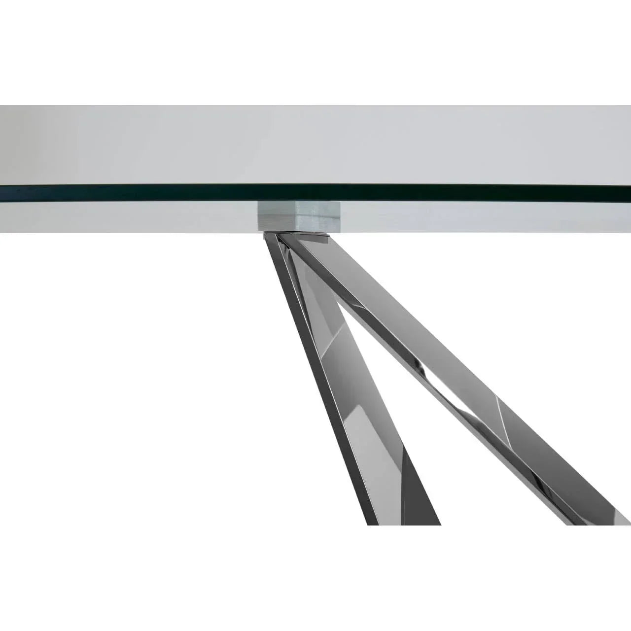 Glass dining table with chrome angled metal legs close-up