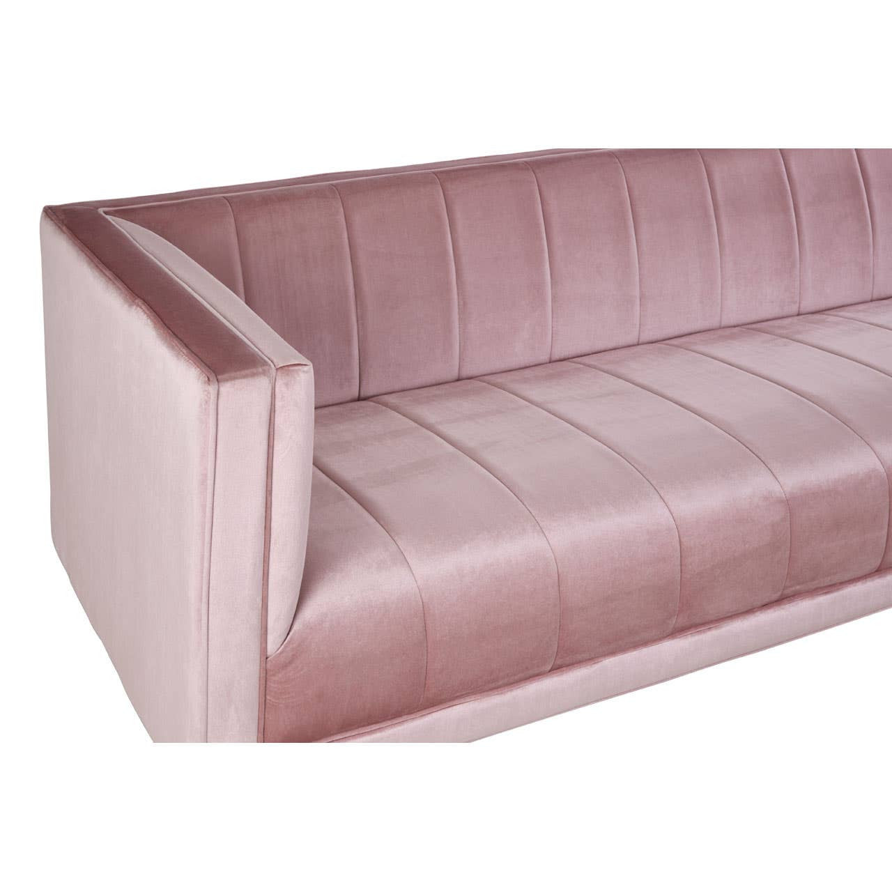 A close-up view of a three-seat pink sofa featuring a sleek design with vertical stitching on the seat cushions and a modern armrest. The fabric has a soft texture, and the overall color is a light, pastel pink