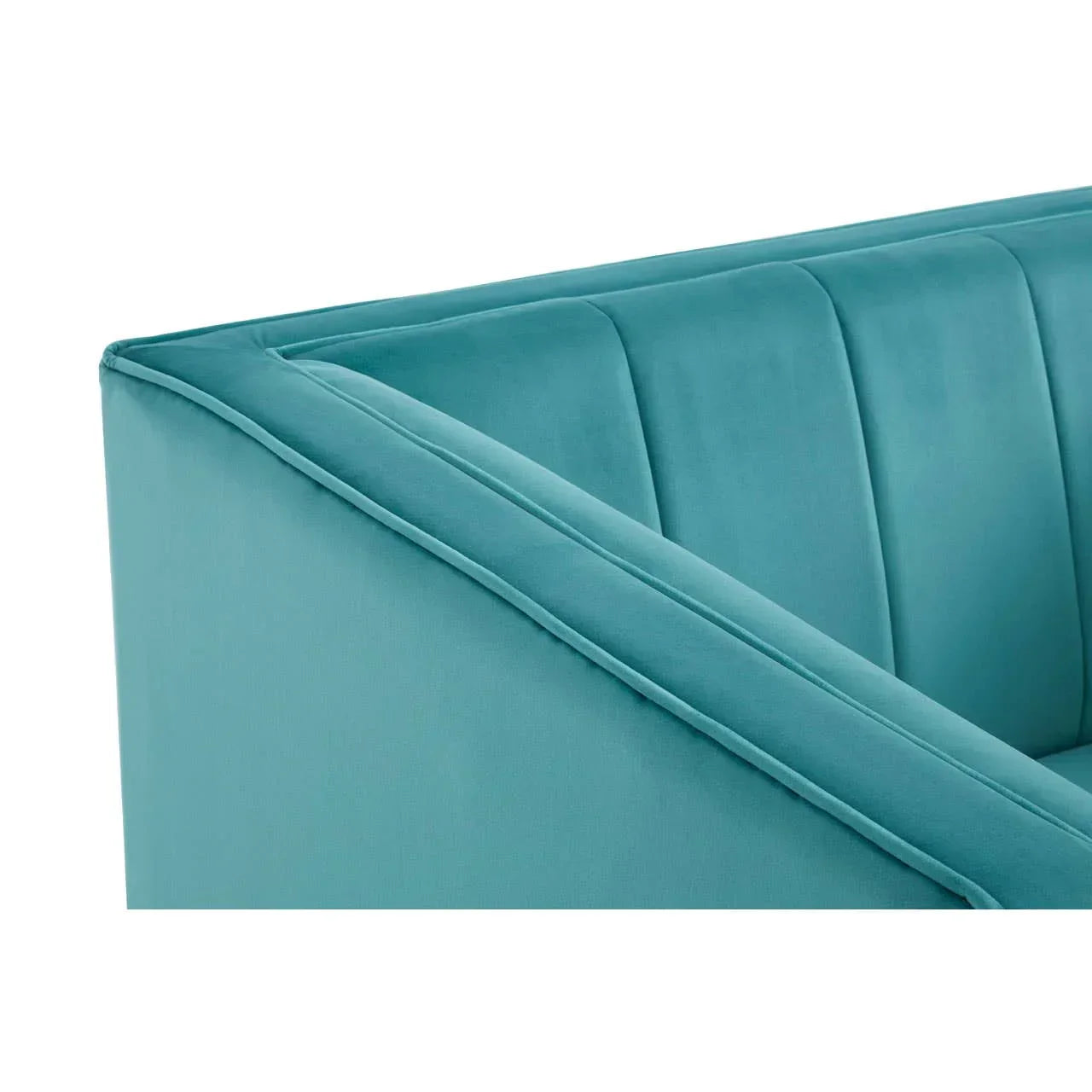 Close-up of teal velvet sofa arm with vertical stitched detail