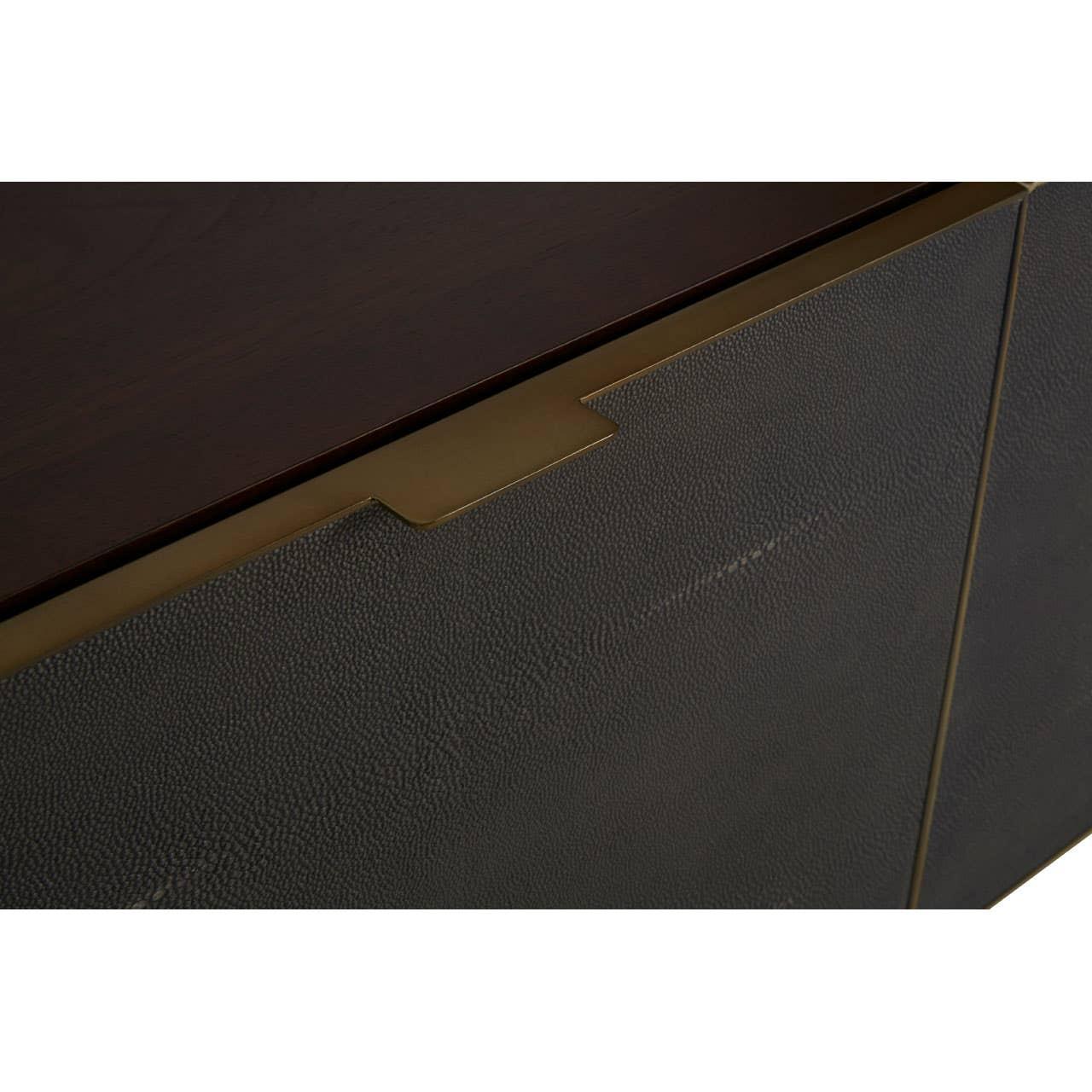 Dark wood sideboard with textured cabinet doors and brass accent handle detail