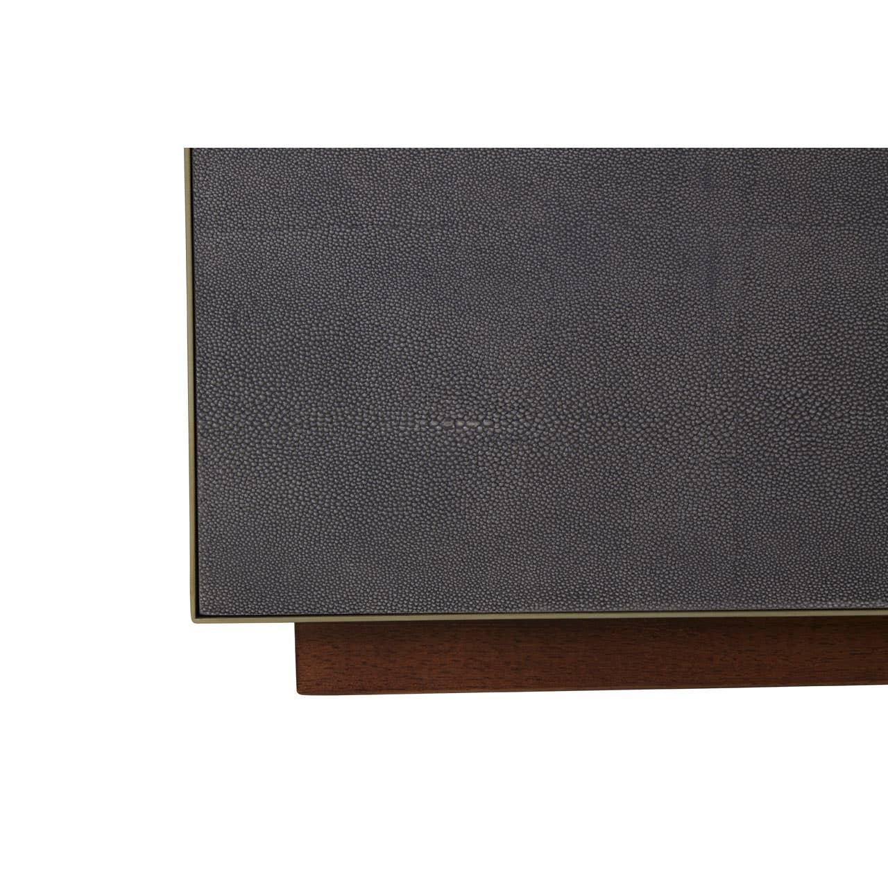 Textured dark grey cabinet door with wooden base, close-up view of furniture detail