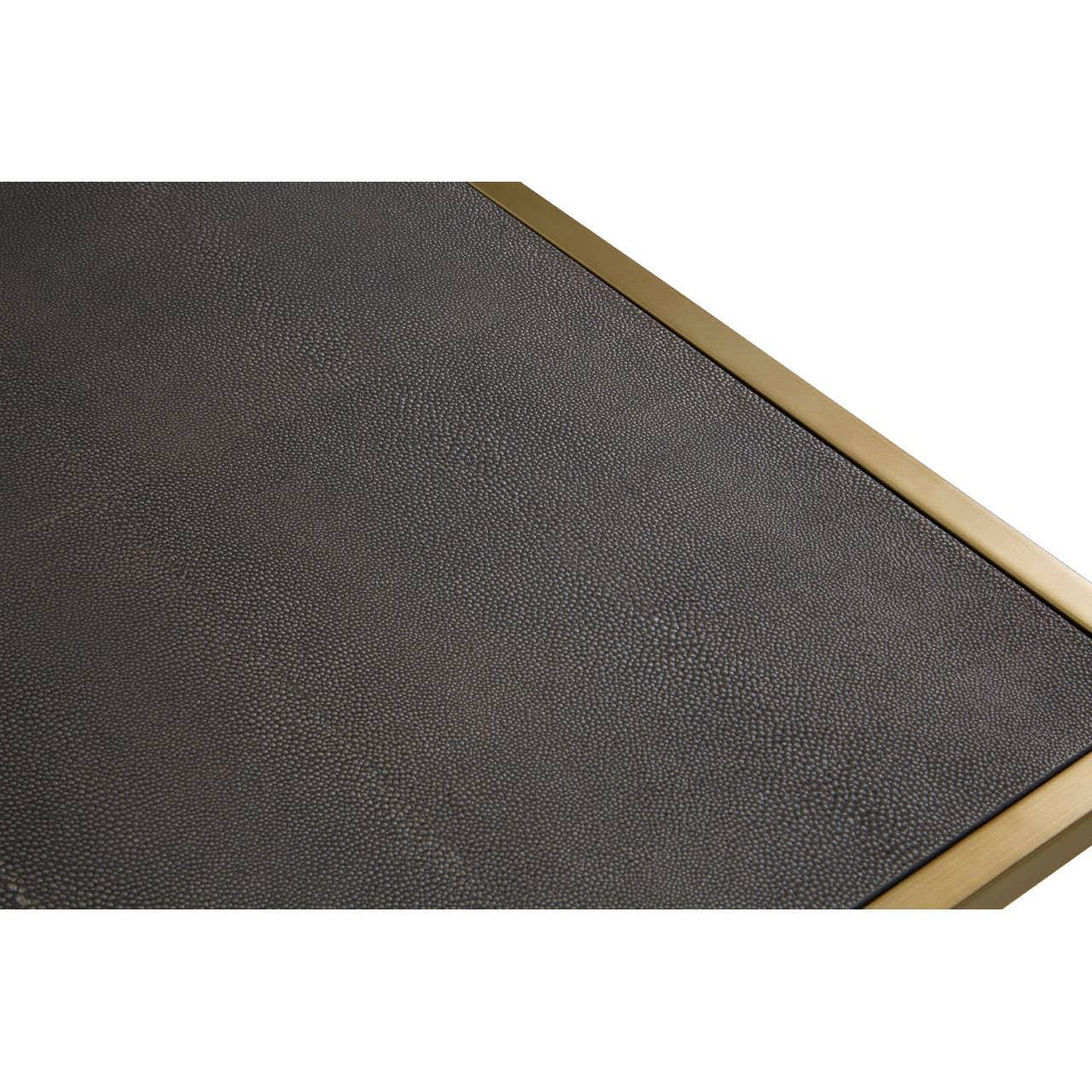 Close up of textured black coffee table top with gold metal edge