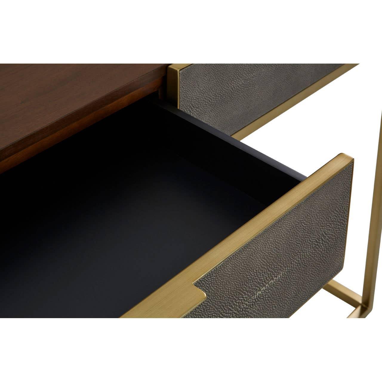 Close view of open sideboard drawer with textured grey front and gold trim