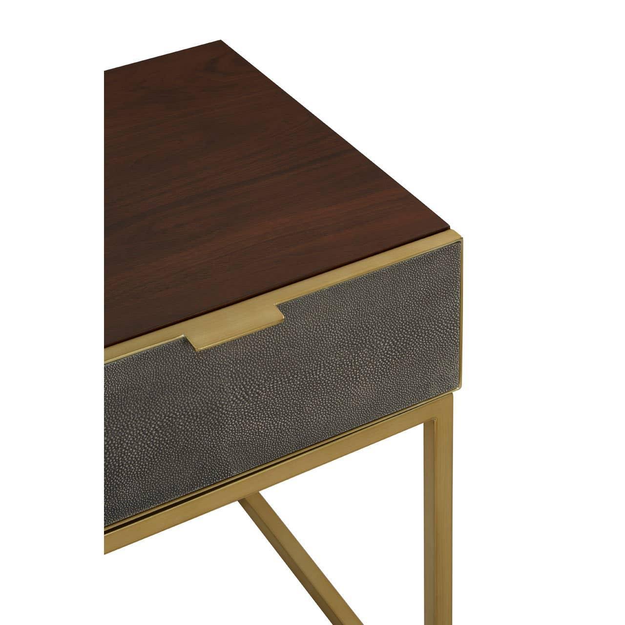 Wood and brass side table with textured drawer front and slim gold metal legs