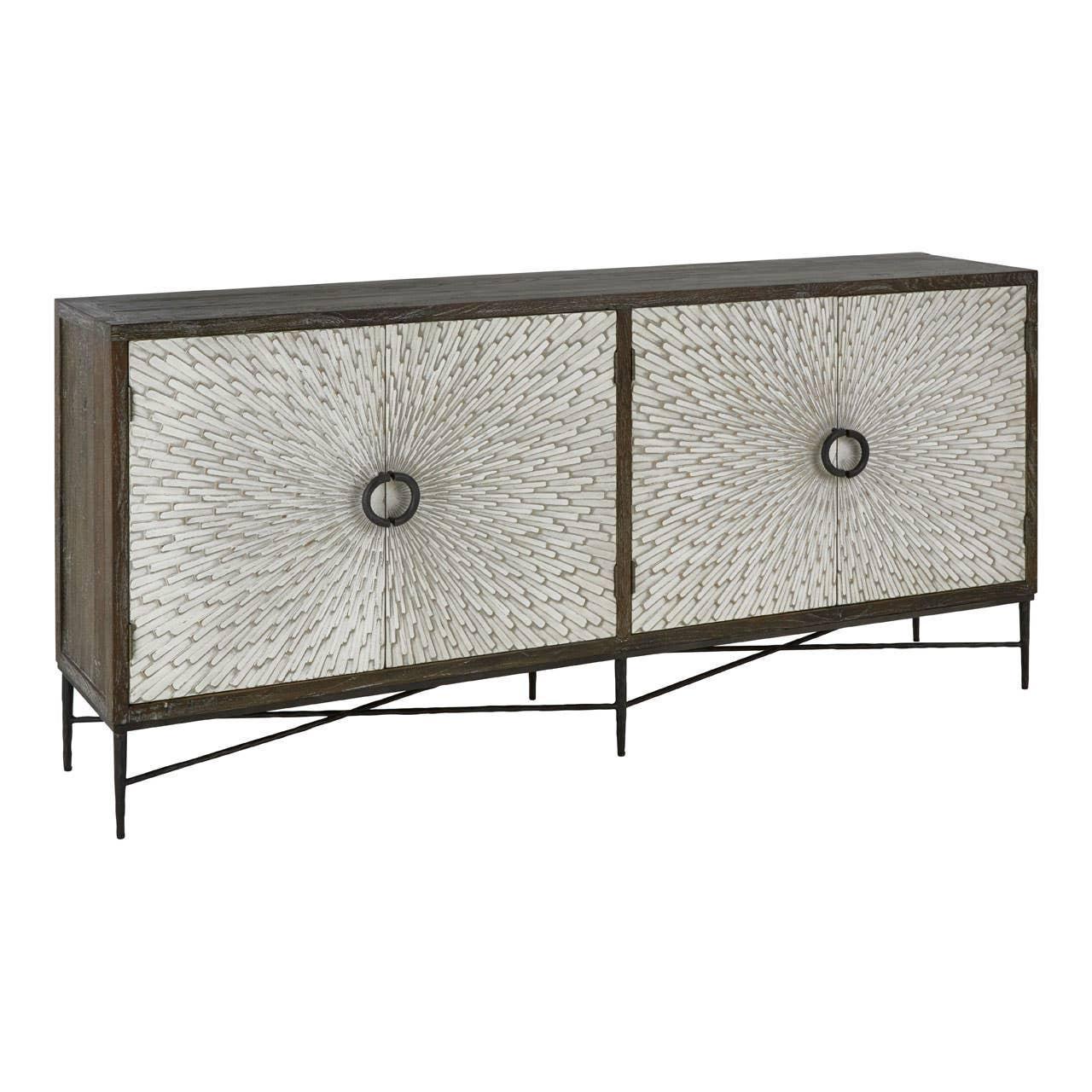 Modern sideboard with textured sunburst doors and metal ring handles on slim legs